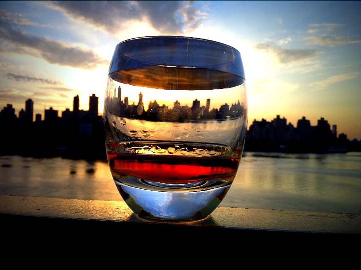 3zpAY Manhattan sunset behind my glass of whiskey last night