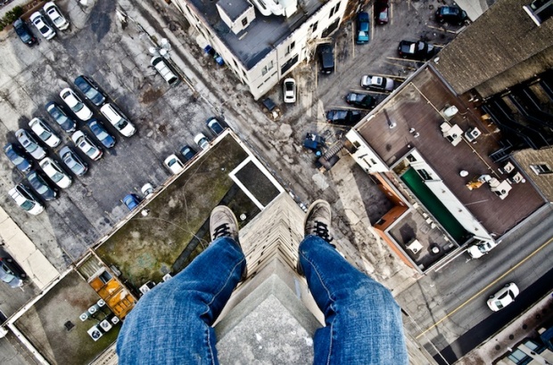 Daredevil Photographer Dangles Off the Edge i1a52 Daredevil Photographer Dangles Off the Edge