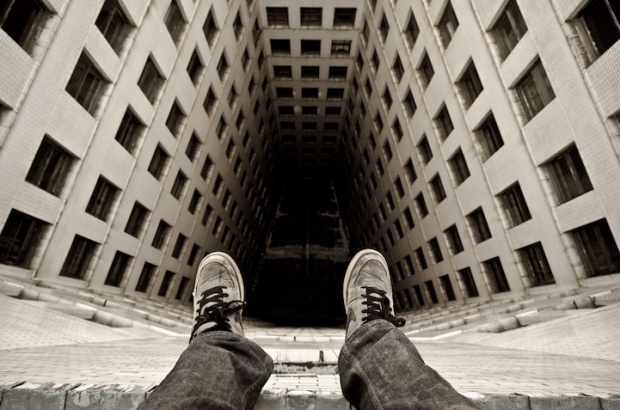 Daredevil Photographer Dangles Off the Edge i1c48 Daredevil Photographer Dangles Off the Edge