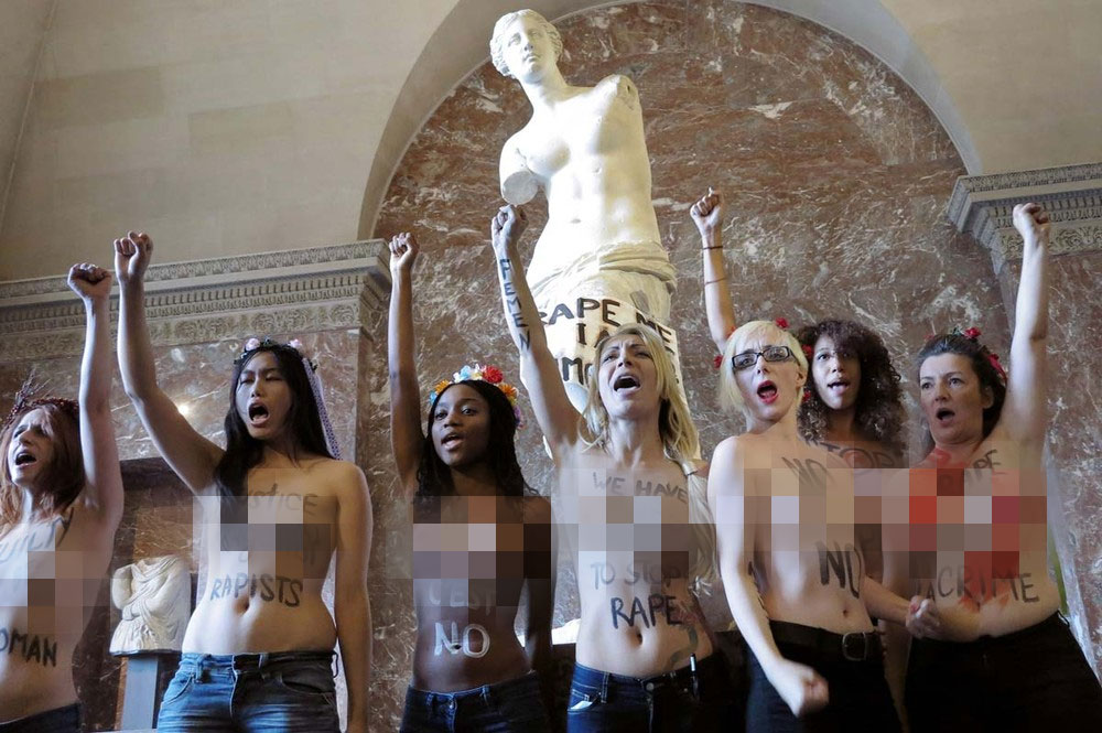 Topless Protest at the Louvre: Half naked FEMEN Campaigners in Paris 140 Topless Protest at the Louvre: Half naked FEMEN Campaigners in Paris