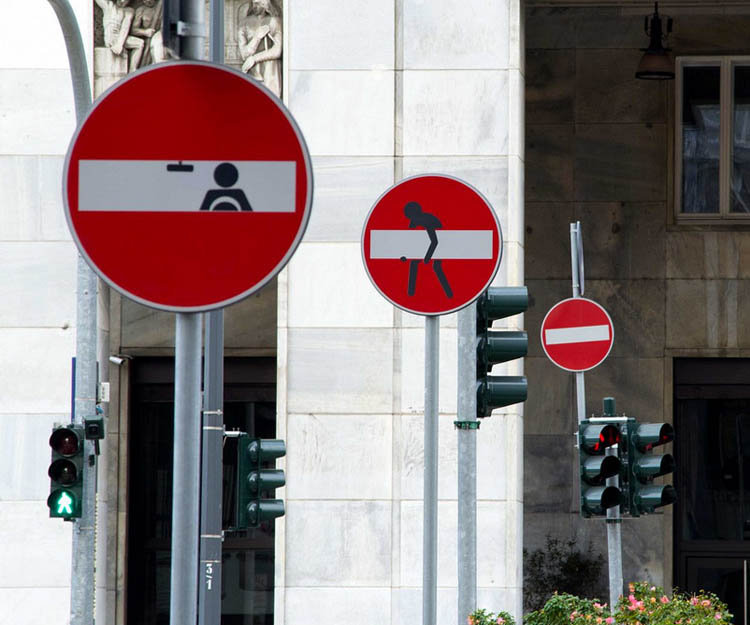 Clet Abraham collabcubed Sticker Street Art on Traffic Signs