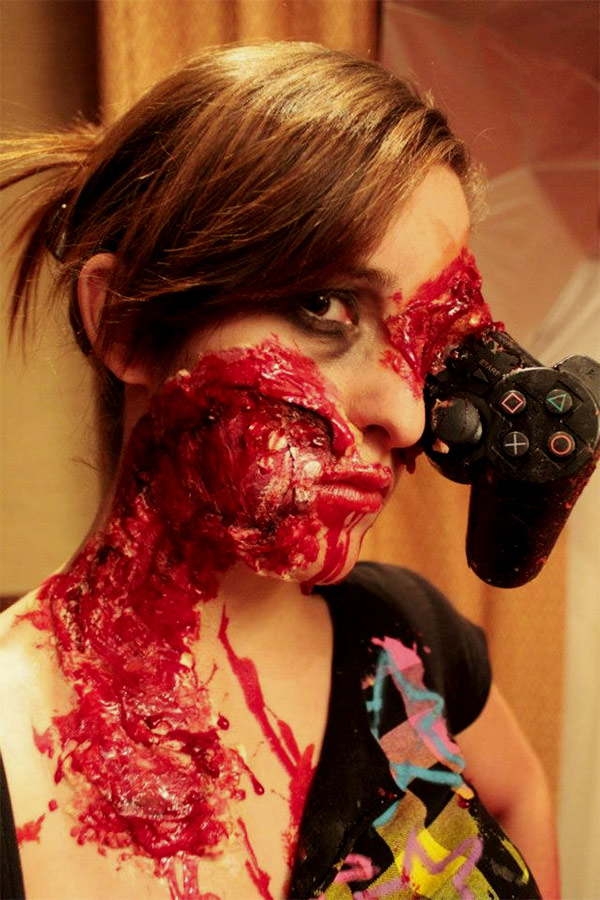 zombie gamer Violent Gamer Zombie Girl with PS3 Controller in the Eye