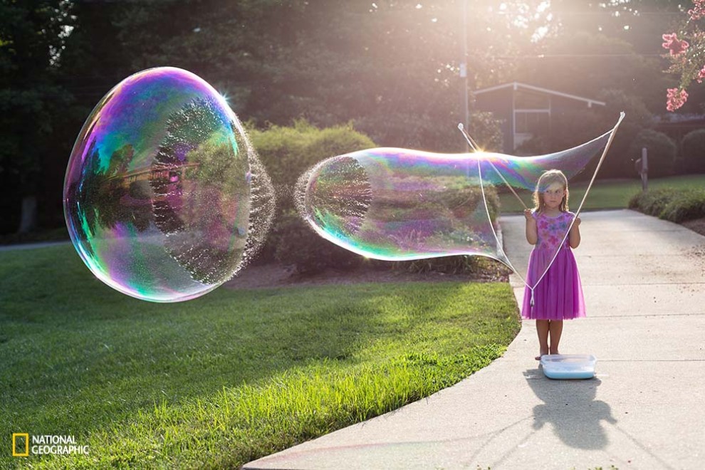 New favorite summer pastime . . . creating gigantic bubbles.  Making them is fun; but, watching them pop is fascinating!