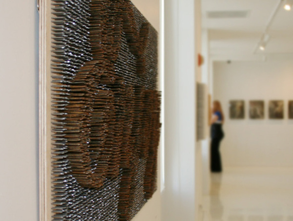  18,000 nails spelling the word “enjoy”