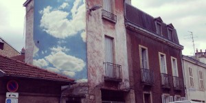 A Street Artist Puts Cloud Prints On Buildings To Brighten City Streets