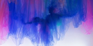 Elegant Figures and Faces of Dancers Emerge from Intricately Folded Sheets of Fabric