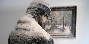 Man Freezes Alongside Icy Painting in Surreal Self-Portrait Sculpture