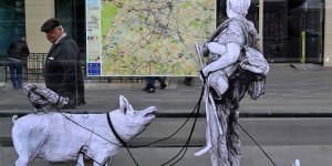 Realistic Wheat-Pasted Figures Playfully Interact with Parisian Streets