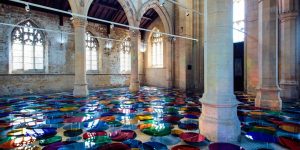 The Floor Of An Historic Church Transformed Into A Reflective Pool Of Multi-Colored Orbs