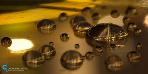 Macro Photos Of Entire Cityscapes Captured Within A Single Drop Of Rainwater