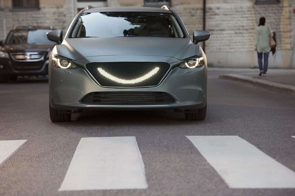 07-when-the-self-driving-cars-sensors-detect-a-pedestrian-a-smile-lights-up-at-the-front-of-the-car-and-the-car-stops