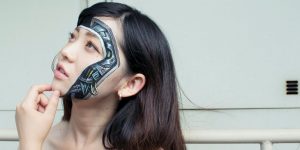Japanese Artist Makes Models Burst At The Seams With Creepy Zips, Buttons And Power Plugs Painted On Their Skin