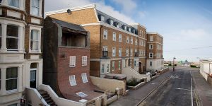 Surreal Sliding House Created By Artist Alex Chinneck