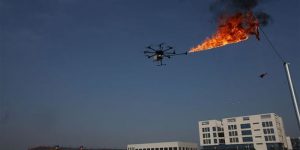 Power Company Uses Drone To Burn Trash Off High Voltage Wires