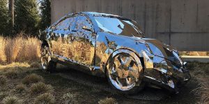 A Wrecked Luxury Car Built From Over 12,000 Reflective Steel Parts