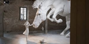 A Girl Encounters A Giant White Horse Frozen In Mid-Air Within The Venice Biennale’s Argentinian Pavilion
