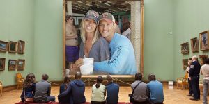 Couple Asks Internet To Photoshop Out Shirtless Guy from Engagement Photo, Regrets It Immediately