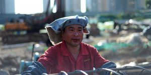 Welders In China Cover Up Despite Summer Heat