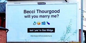 Graphic Designer Uses Gigantic Billboard To Propose To Girlfriend – And Asks For Answer By Text