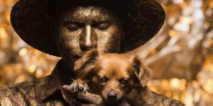 Street Artist Incorporates His Matching Little Brown Dog Into His Living Bronze Statue Routine
