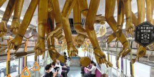 Train In Japan Decorated With Thousand-Armed Kannon Limbs Hanging From Carriage Ceiling