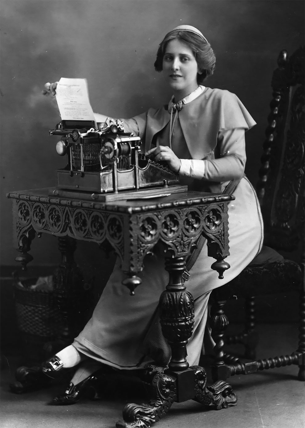 Woman Working At Typewriter by George Marks
