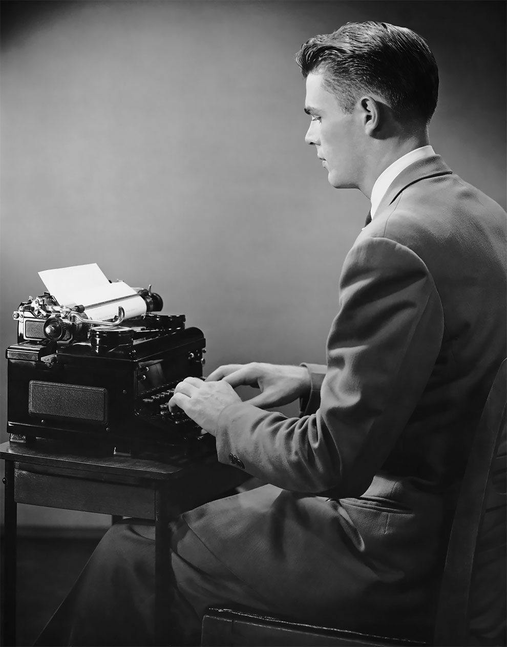 Woman Working At Typewriter by George Marks