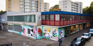 Street Artists Painted The Facade Of Local Supermarket In Hamburg With A Retro-Futuristic Mural That Reflects On Our Relationship To Groceries