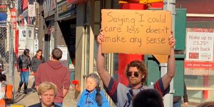 This Brave Man Protests Annoying Everyday Things With Funny Signs