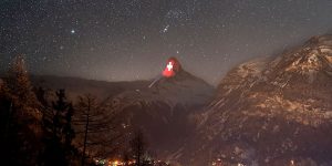 Swiss Village Has Been Projecting World Flags Onto One Of Their Tallest Mountains In Solidarity Of Pandemic