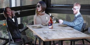 A Restaurant In Australia Is Placing Cardboard Cutouts At Its Tables In An Attempt To Make Diners Feel More Comfortable