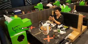 This Restaurant In Bangkok Uses Cartoon Dragon Dolls As Space Keepers For Social Distancing