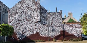 Warsaw-Based Artist Spray-Paints A Beautiful Lace Mural On The Side Of A French Lace Museum