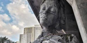 Giant Sculpture Of A Woman Opening Her Chest To Reveal A Fern-Covered Tunnel Appears In Florida