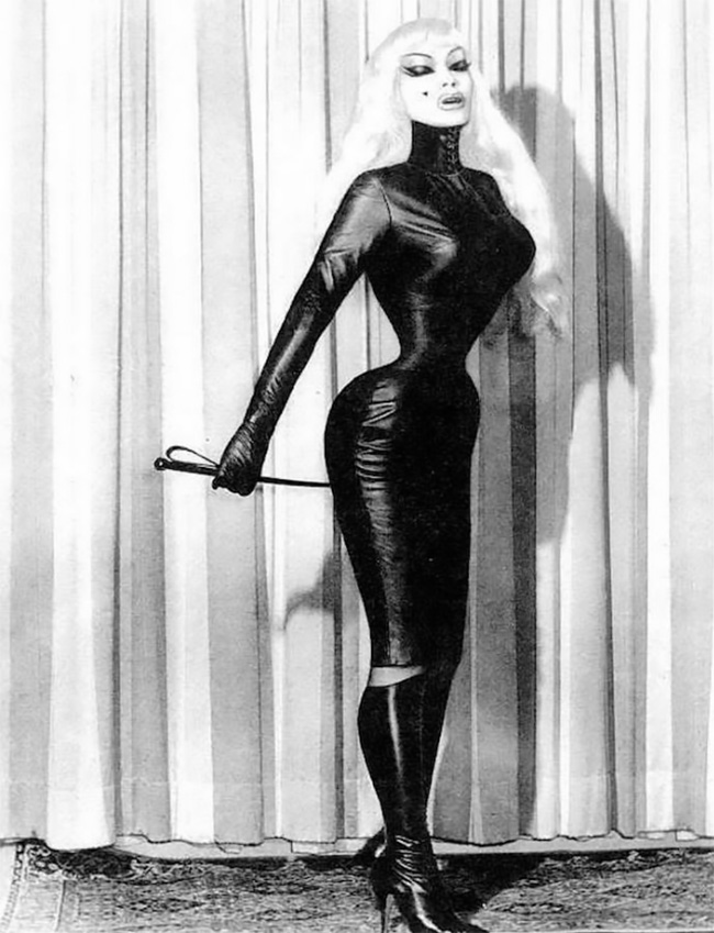 Cora Korsett was a German BDSM dominatrix and body modification fetish  model. Not much is known about her, apart from she was well over 6