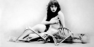 Kiss Me, My Fool!: Theda Bara, the Original Vamp, Posing With a Skeleton as Publicity for the Silent Film ‘A Fool There Was’, 1915