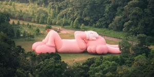 KAWS Unveils Colossal 150ft Pink Rabbit Sculpture at Prambanan Temple in Indonesia